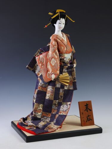 Japanese Traditional Geisha Doll with Vintage Charm Kimono and Fan Collectible.