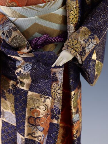 Japanese Traditional Geisha Doll with Vintage Charm Kimono and Fan Collectible.